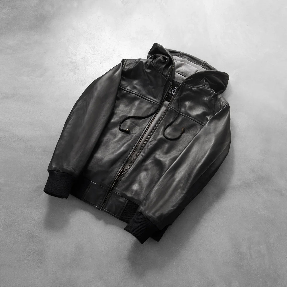 
Rib knit & Hem Craftsmanship Construction Detail on Nintenzo Black Hooded Leather Jacket